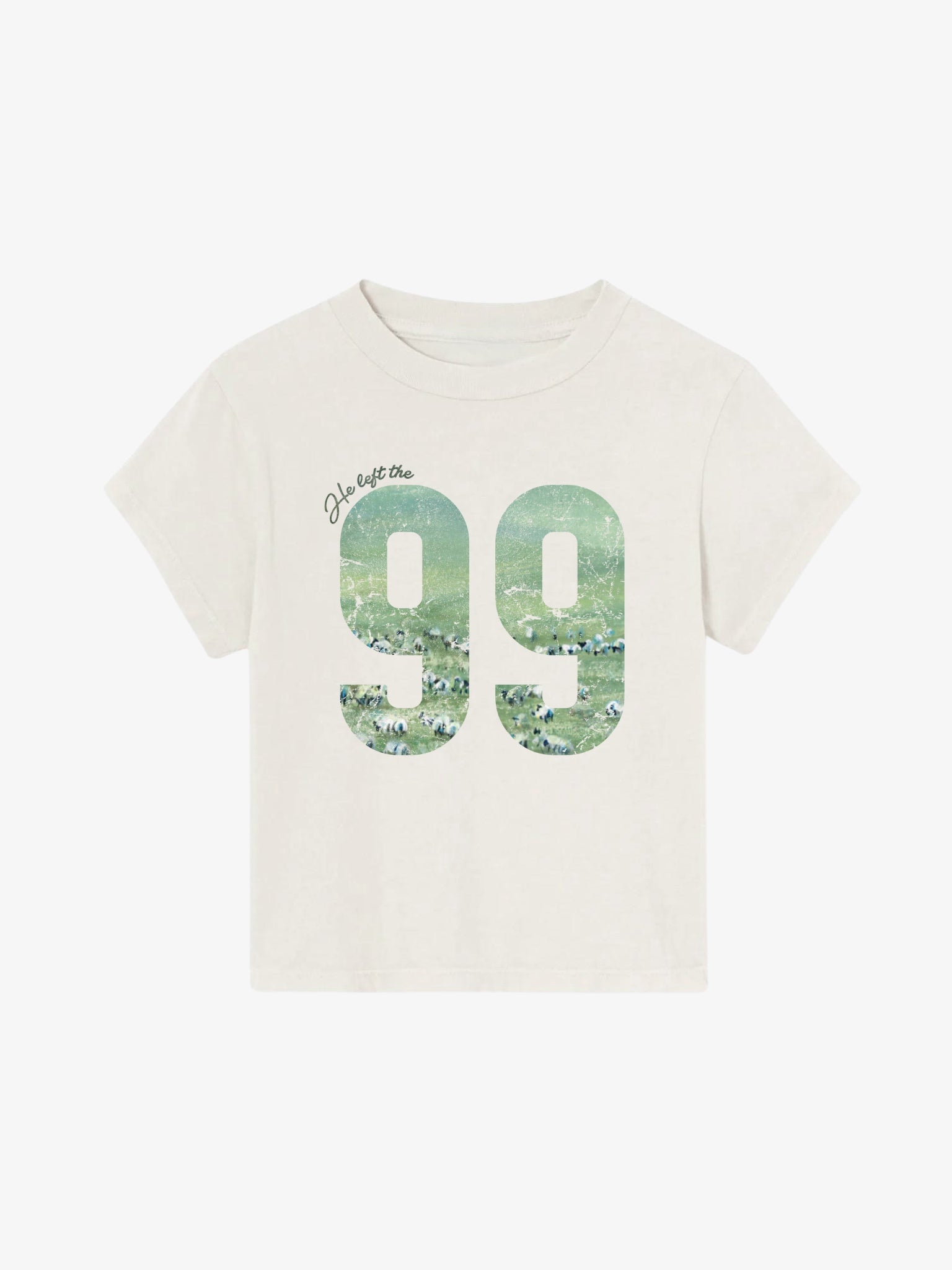 SĒK Apparel He Left the 99 Baby Tee in beige — flat lay of off-white baby tee with '99' graphic filled with sheep, inspired by the parable of the lost sheep