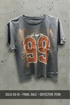SĒK Apparel He Left the 99 Baby Tee in blue — defect unit showing print imperfection on '99' graphic, sold as-is