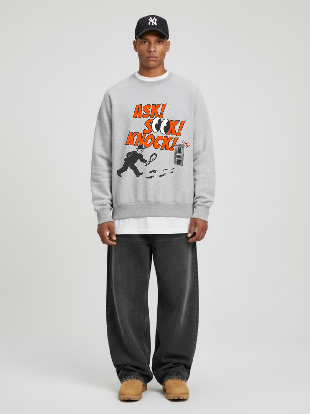 Man wearing the SĒK Apparel Ask, Seek, Knock Crewneck in heather gray — front view of faith-inspired Christian sweatshirt with Matthew 7:7 graphic design, on white background