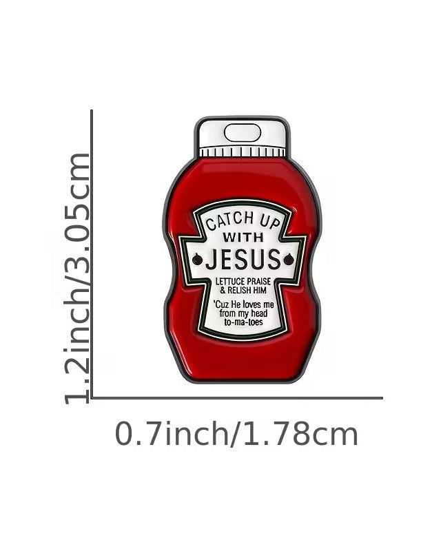 Red ketchup bottle-shaped enamel pin with 'Catch Up With Jesus' text, measurements on a white background
