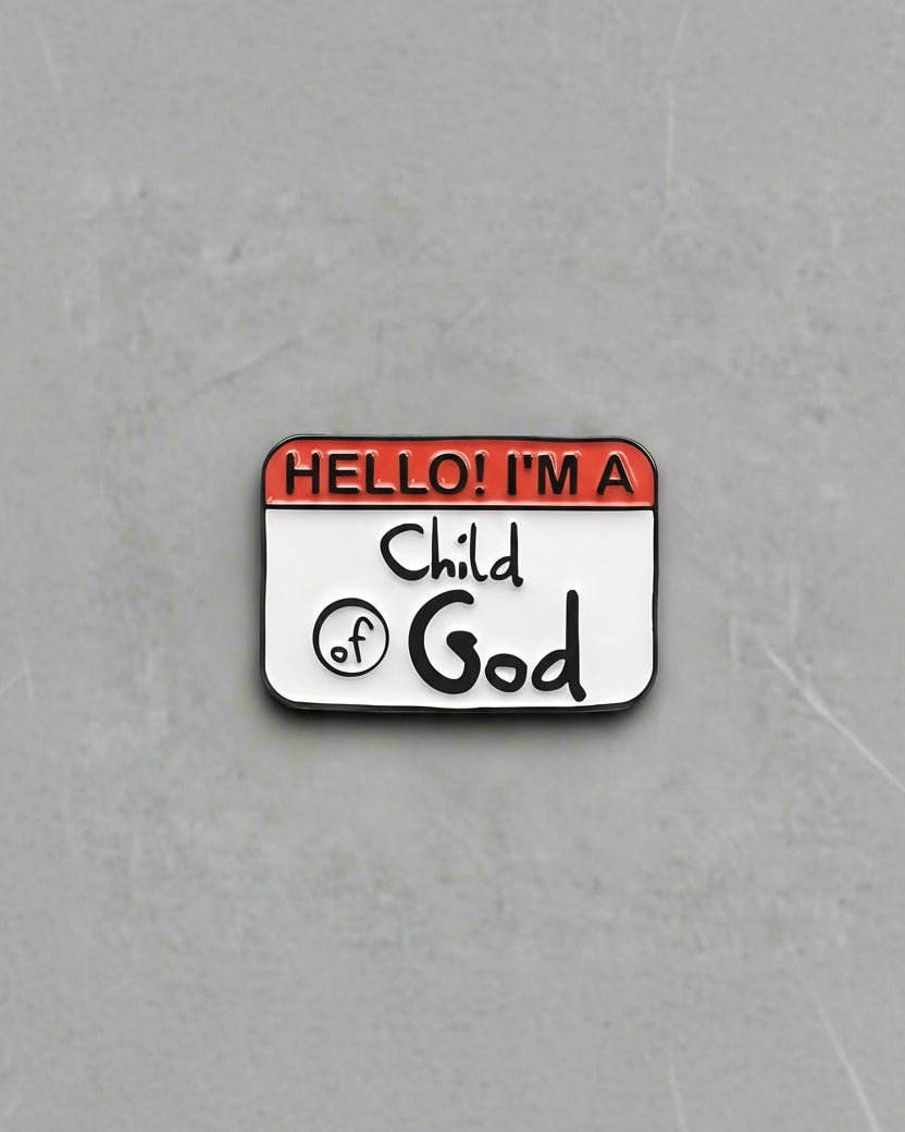 A pin with a name tag that reads 'Hello! I'm a Child of God'.