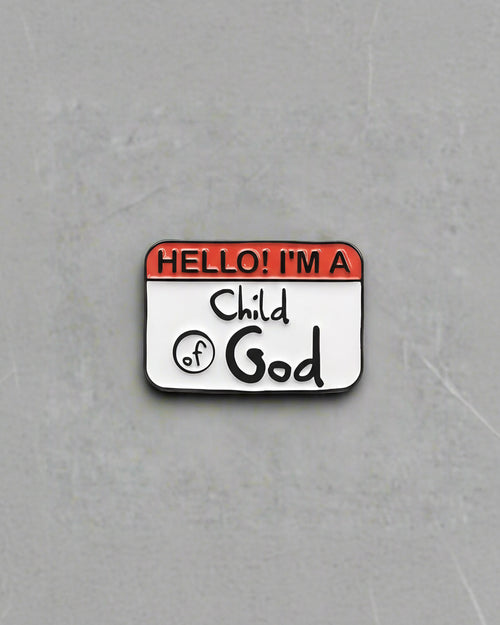 A pin with a name tag that reads 'Hello! I'm a Child of God'.