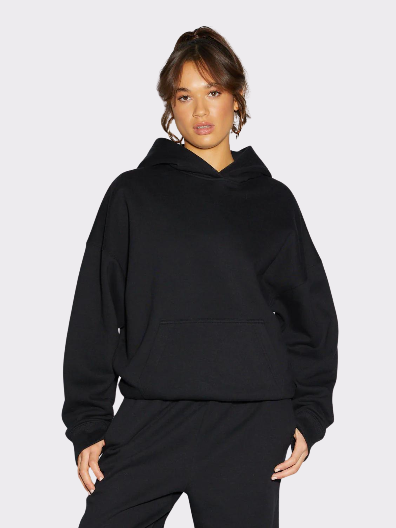 Woman wearing the SĒK Apparel Christ-Minded Hoodie in black — front view of faith-inspired Christian pullover hoodie