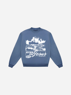 SĒK Apparel Eyes on Jesus Crewneck in blue — flat lay with 'Eyes on Jesus' text and Jesus on water, faith-inspired Christian sweatshirt referencing Hebrews 12:2