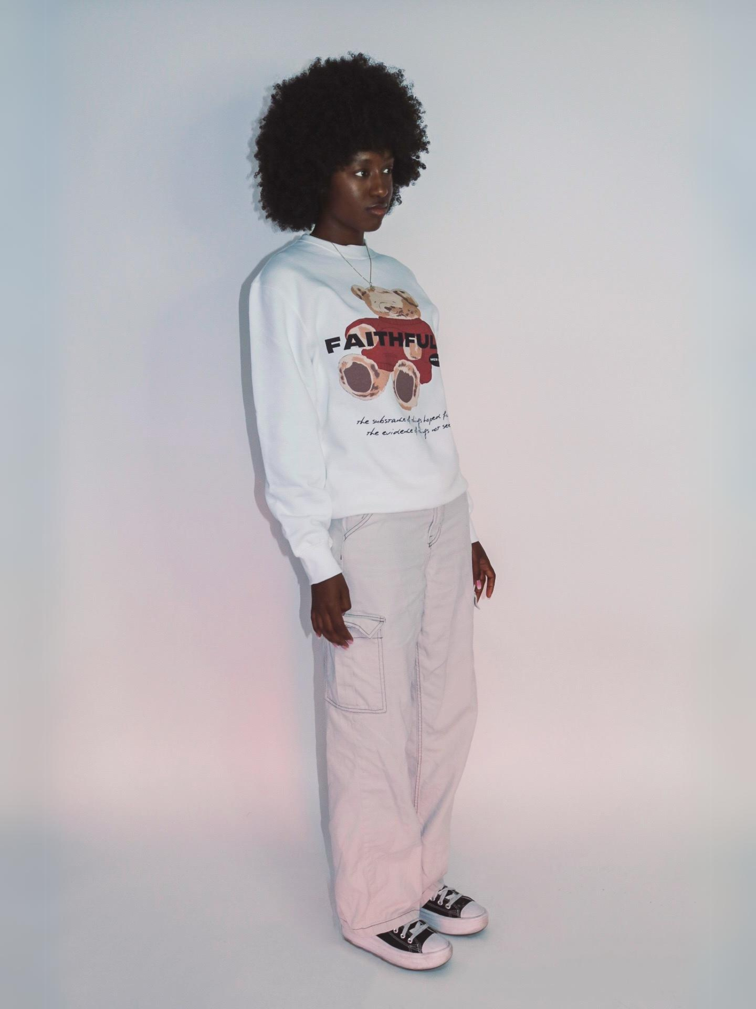 Woman wearing the SĒK Apparel FaithFULL Crewneck — front view of faith-inspired Christian sweatshirt with bear graphic design