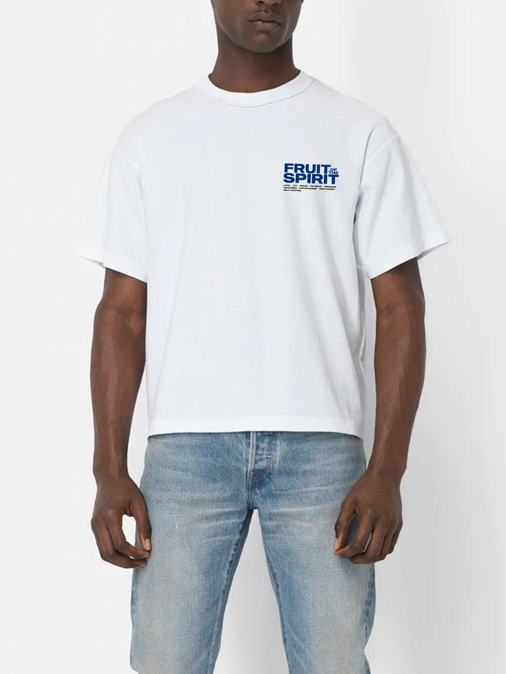 Man wearing the SĒK Apparel Fruit of the Spirit Box Tee in white — front view of faith-inspired Christian graphic tee