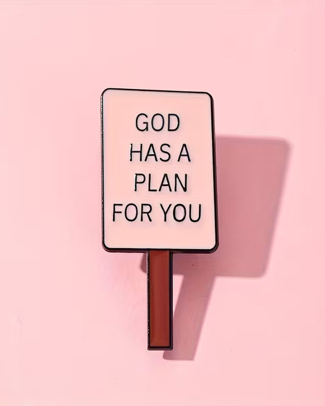 Sign with 'GOD HAS A PLAN FOR YOU' text on a pink background