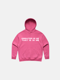 SĒK Apparel Greater is He Hoodie in pink — flat lay of faith-inspired Christian pullover hoodie with 'Greater is He That is in Me' text, referencing 1 John 4:4