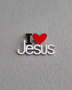 SĒK Apparel I Love Jesus enamel pin — white pin with 'I ❤️ JESUS' text and red heart symbol, faith-inspired Christian lapel pin