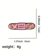 Pink bandage with 'Jesus Heals' text and smiley faces, shown with measurements and weight on a white background.