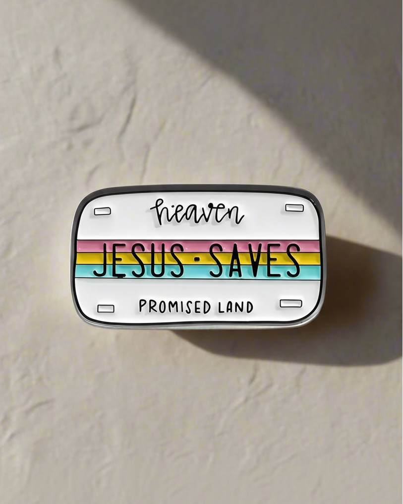 SĒK Apparel Jesus Saves enamel pin — multicolored license plate style pin with 'Jesus Saves' text, faith-inspired Christian lapel accessory