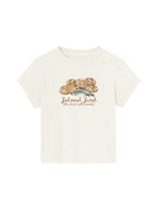 SĒK Apparel Jehovah Jireh Baby Tee in off-white — flat lay of faith-inspired Christian baby tee with bread illustration and 'Jehovah Jireh — The Lord Will Provide' text
