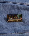 SĒK Apparel Last Supper enamel pin —shown pinned to denim fabric