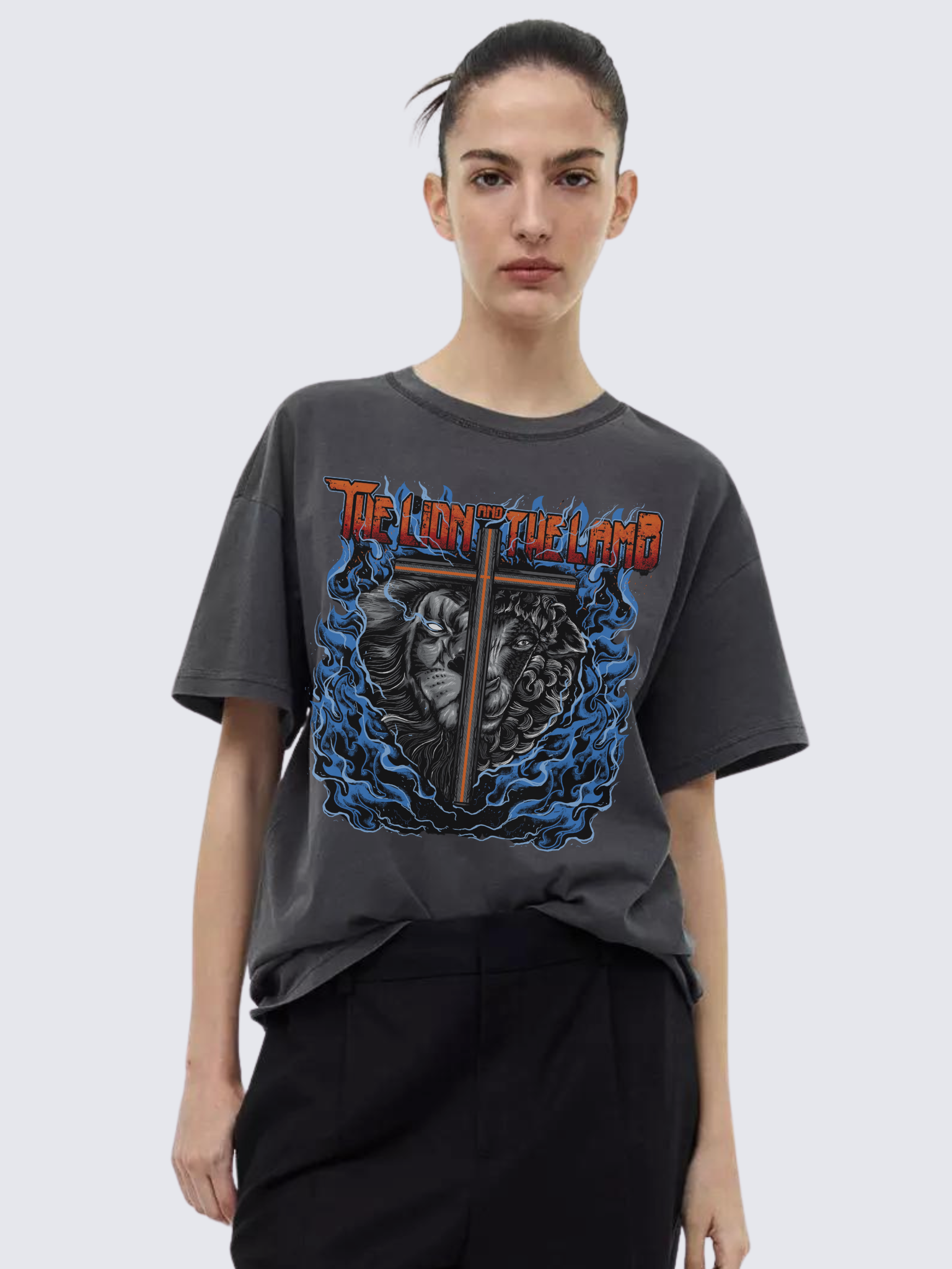 Woman wearing the SĒK Apparel Lion & The Lamb Vintage Tee — front view of faith-inspired Christian vintage graphic tee with lion and lamb design, referencing Isaiah 11:6