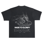 SĒK Apparel Made to Glorify Tee in faded black — flat lay back view with bold 'Made to Glorify' text graphic