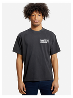 Man wearing the SĒK Apparel Made to Glorify Tee in faded black — front view of faith-inspired Christian graphic tee