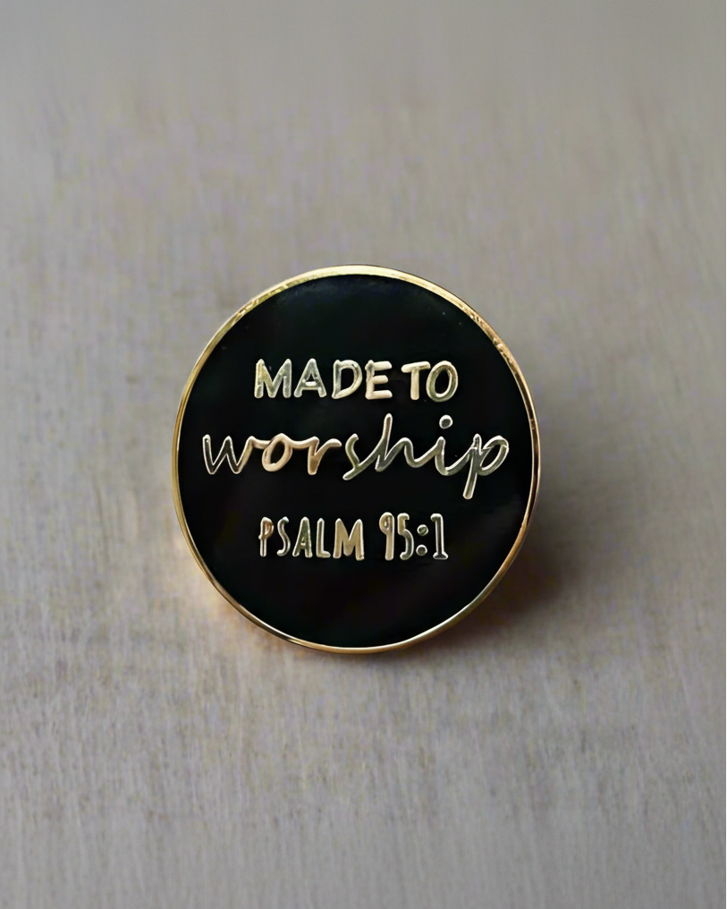 SĒK Apparel Made to Worship enamel pin — black pin with gold edging, 'Made to Worship' in white and 'Psalm 95:1' in gold, faith-inspired Christian lapel pin