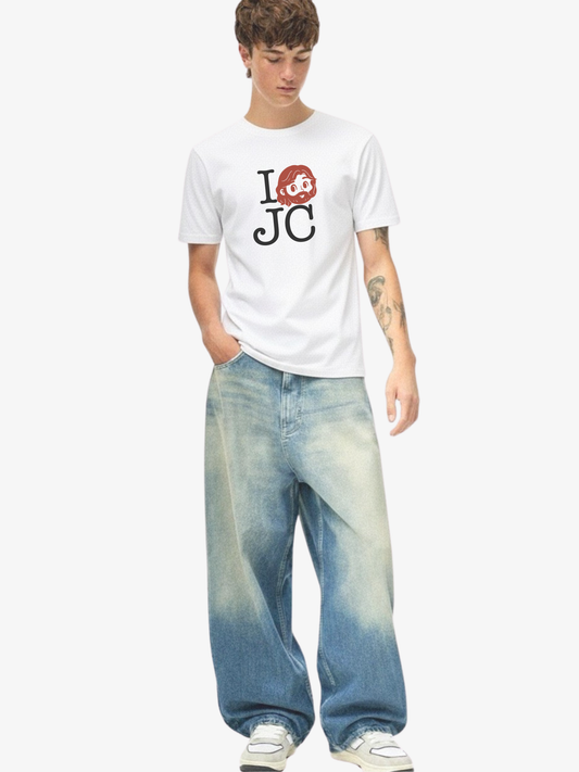 Person wearing a white t-shirt with a graphic design and blue jeans on a white background