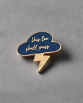 SĒK Apparel This Too Shall Pass enamel pin — blue cloud and lightning bolt design with 'This Too Shall Pass' text, faith-inspired Christian encouragement lapel pin