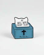 Blue box with a white sign reading 'He will wipe every tear' and a black cross, on a white background.