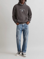 Model wearing SĒK Apparel Wait on the Lord Hoodie in gray with blue jeans and white sneakers — Isaiah 40:31 Christian hoodie