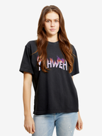 Woman wearing the SĒK Apparel YAHWEH Tee in black — front view of faith-inspired Christian graphic tee with bold 'YAHWEH' text
