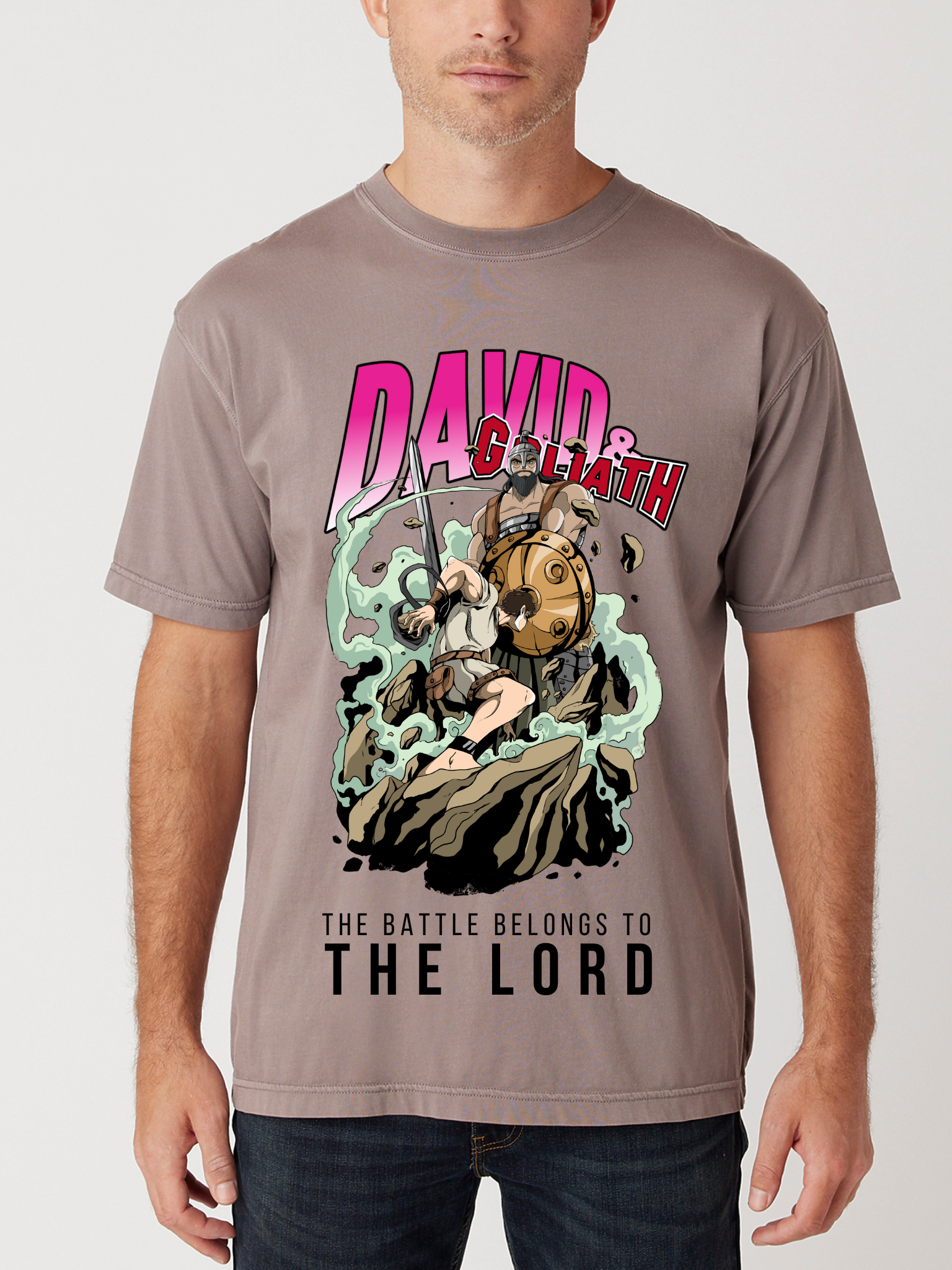Man wearing the SĒK Apparel David & Goliath Vintage Tee in brown — front view of faith-inspired Christian graphic tee with David and Goliath story design
