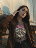 Woman wearing the SĒK Apparel David & Goliath Vintage Tee in brown — faith-inspired Christian graphic tee with David and Goliath biblical story artwork